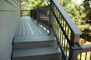Composite stairs with metal hand rail
